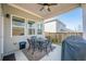 Covered patio features outdoor seating and a ceiling fan, ideal for outdoor enjoyment at 614 Denali Dr, Mableton, GA 30126
