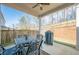 Outdoor covered patio with furniture and grill; perfect for entertaining guests and enjoying the outdoor space at 614 Denali Dr, Mableton, GA 30126