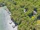 Lakeside property with serene waterfront views and private docks surrounded by lush greenery and mature trees at 7530 Heard Rd, Cumming, GA 30041