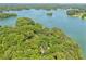 Scenic lakefront acreage surrounded by trees, offering a private and tranquil retreat on the water at 7530 Heard Rd, Cumming, GA 30041
