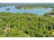 Expansive lake view with private wooded acreage, providing a serene and picturesque setting at 7530 Heard Rd, Cumming, GA 30041