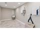 Unfinished basement with neutral tile, utility sink and hookups, ready for your vision at 7530 Heard Rd, Cumming, GA 30041