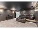 Finished home theater with comfortable seating and a large screen at 7530 Heard Rd, Cumming, GA 30041