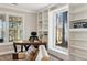 Bright office space boasts built-in shelving and views of the backyard and lake at 7530 Heard Rd, Cumming, GA 30041