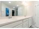 Bathroom with a large mirror over the double sink vanity and white cabinets at 1012 Rohner Way, Smyrna, GA 30080