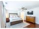 Spacious bedroom with a large window, ceiling fan, wood floors, and a flat screen TV at 1012 Rohner Way, Smyrna, GA 30080