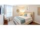 Bedroom with a neutral palette, a window, and a light-colored wood floor at 1012 Rohner Way, Smyrna, GA 30080