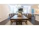 Open-concept dining room and living room showcasing dark wood floors and neutral tones at 1012 Rohner Way, Smyrna, GA 30080