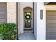 Charming townhome entrance features a wreath on the door and lush greenery, creating a welcoming atmosphere at 1012 Rohner Way, Smyrna, GA 30080