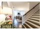 Inviting entryway with dark hardwood floors and staircase leading to the open-concept living and dining area at 1012 Rohner Way, Smyrna, GA 30080