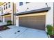 Close-up shot of a townhome garage with a modern design and well-kept landscaping at 1012 Rohner Way, Smyrna, GA 30080