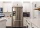 Close-up of a stainless steel refrigerator and white cabinets in a modern kitchen at 1012 Rohner Way, Smyrna, GA 30080