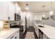 Bright kitchen featuring white cabinets, quartz counters, stainless appliances, and a stylish subway tile backsplash at 1012 Rohner Way, Smyrna, GA 30080