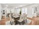 Elegant dining room with natural light, and a large mirror wall reflecting the table and decor at 1054 Club Ne Pl, Atlanta, GA 30319