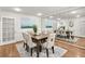 Elegant dining room with wood floors and a large mirror wall reflecting the table and decor at 1054 Club Ne Pl, Atlanta, GA 30319