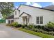 Charming, newly renovated two-story home showcasing landscaped yard and light-colored siding with a dark roof at 1054 Club Ne Pl, Atlanta, GA 30319