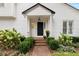 Home's entry offers a brick path leading to the front door with garden-like landscaping at 1054 Club Ne Pl, Atlanta, GA 30319