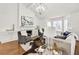 Living room with hardwood floors, lots of natural light, fireplace, and modern decor at 1054 Club Ne Pl, Atlanta, GA 30319