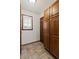 Spacious mudroom features custom wood cabinets and tile flooring, offering ample storage and style at 1054 Club Ne Pl, Atlanta, GA 30319