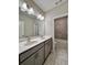 Bright bathroom features a double sink vanity with a white countertop and tile floors at 4316 Waxwing St, Buford, GA 30548