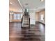 Open hallway with hardwood floors, staircase, and ample natural light at 4316 Waxwing St, Buford, GA 30548