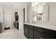 Bright bathroom with dual vanities, marble countertops, and recessed lighting at 6170 Wellington Ct, Cumming, GA 30040