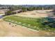 Image of the golf course driving range with a row of hitting mats, providing a dedicated space for golfers to practice at 6170 Wellington Ct, Cumming, GA 30040