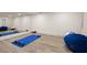 Bright home gym featuring a large mirror, workout mat and equipment, and a comfortable beanbag chair at 6170 Wellington Ct, Cumming, GA 30040