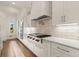 Well-lit kitchen with white cabinets and stainless steel appliances at 6170 Wellington Ct, Cumming, GA 30040