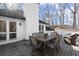 Spacious outdoor deck with dining table and lounge chairs offers a relaxing outdoor living space at 6170 Wellington Ct, Cumming, GA 30040