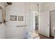 Modern shower featuring a glass enclosure, pebble accents, and a convenient shower bench at 6170 Wellington Ct, Cumming, GA 30040