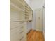 Walk-in closet with custom shelving and storage at 978 North Ne Ave # 307, Atlanta, GA 30306