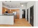 Open kitchen and dining area with stainless steel appliances, hardwood floors, and dark-colored doors at 978 North Ne Ave # 307, Atlanta, GA 30306