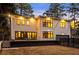Modern home highlighting a spacious deck, large windows, and a private backyard at 4132 Carmain Ne Dr, Atlanta, GA 30342