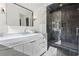 Elegant bathroom showcasing a marble countertop, modern vanity, and a glass-enclosed shower with dark tiling at 4132 Carmain Ne Dr, Atlanta, GA 30342