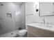 Modern bathroom features a glass-enclosed shower and stylish vanity with marble countertop and a sleek mirror at 4132 Carmain Ne Dr, Atlanta, GA 30342