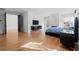 Modern primary bedroom featuring hardwood floors, fireplace and an abundance of natural light at 4132 Carmain Ne Dr, Atlanta, GA 30342