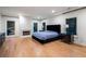 Spacious bedroom with hardwood floors, fireplace, and plenty of natural light from large windows at 4132 Carmain Ne Dr, Atlanta, GA 30342