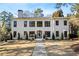 Stunning two-story home featuring modern architecture, black-framed windows, and a beautifully landscaped front yard at 4132 Carmain Ne Dr, Atlanta, GA 30342