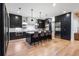 Contemporary kitchen featuring a center island with barstool seating, black cabinetry and stainless appliances at 4132 Carmain Ne Dr, Atlanta, GA 30342