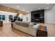 Bright living room featuring hardwood floors, modern fireplace and a stylish wooden plank ceiling at 4132 Carmain Ne Dr, Atlanta, GA 30342