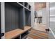 Well-organized mudroom with custom shelving, bench seating, and convenient storage solutions, enhancing functionality and style at 4132 Carmain Ne Dr, Atlanta, GA 30342