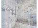 Detail of a luxurious marble shower with built-in niche and bench seating at 4132 Carmain Ne Dr, Atlanta, GA 30342