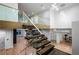 Elegant staircase with glass railings and wood treads, offering a bright, open design at 4132 Carmain Ne Dr, Atlanta, GA 30342
