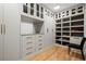 Organized walk-in closet with custom shelving, drawers, and ample storage space for shoes and clothing at 4132 Carmain Ne Dr, Atlanta, GA 30342
