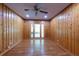 Spacious living room with wood paneled walls and hardwood floors at 636 Counsel Ne Dr, Marietta, GA 30068