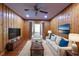 Inviting living room with wood paneled walls, hardwood floors, and neutral furniture at 636 Counsel Ne Dr, Marietta, GA 30068