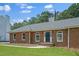 Inviting brick facade with a well-kept lawn, arched windows, and a stately entrance at 9035 Teal Ln, Jonesboro, GA 30236