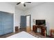 Bedroom with wood floors, ceiling fan, vintage desk, and closet at 1171 Eggleston Sw St, Atlanta, GA 30310