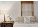 Close-up of bedroom with natural light, wooden blinds, and a pillow with an inspirational message at 1171 Eggleston Sw St, Atlanta, GA 30310